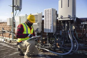 Facilities management technician checking on an HVAC unit