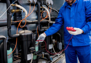 Hard FM engineer inspecting HVAC system as part of retail facilities management services UK